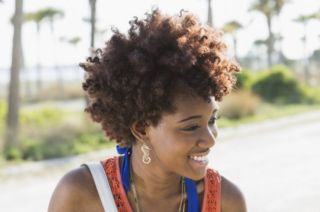Young black woman on sunny summer day