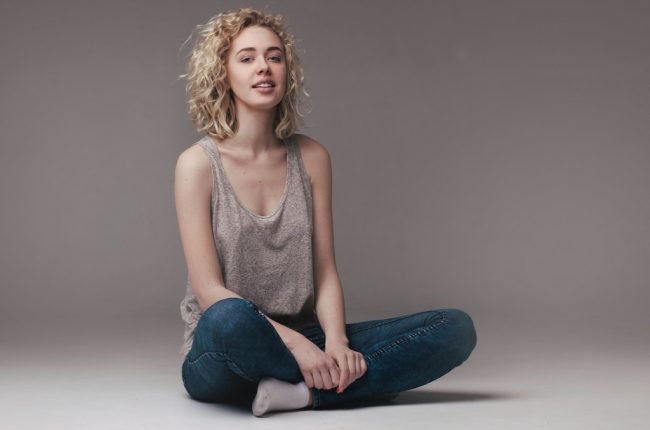 fashion portrait of blond sitting woman