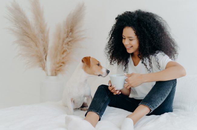 Horizontal,Shot,Of,Happy,Afro,American,Woman,Spends,Leisure,Time